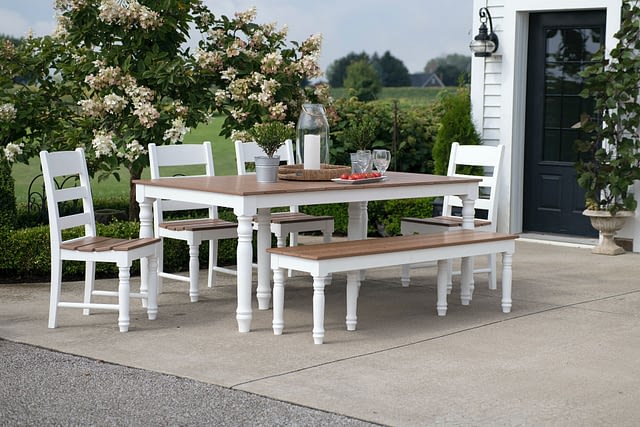 white outdoor table and chairs on backyard patio